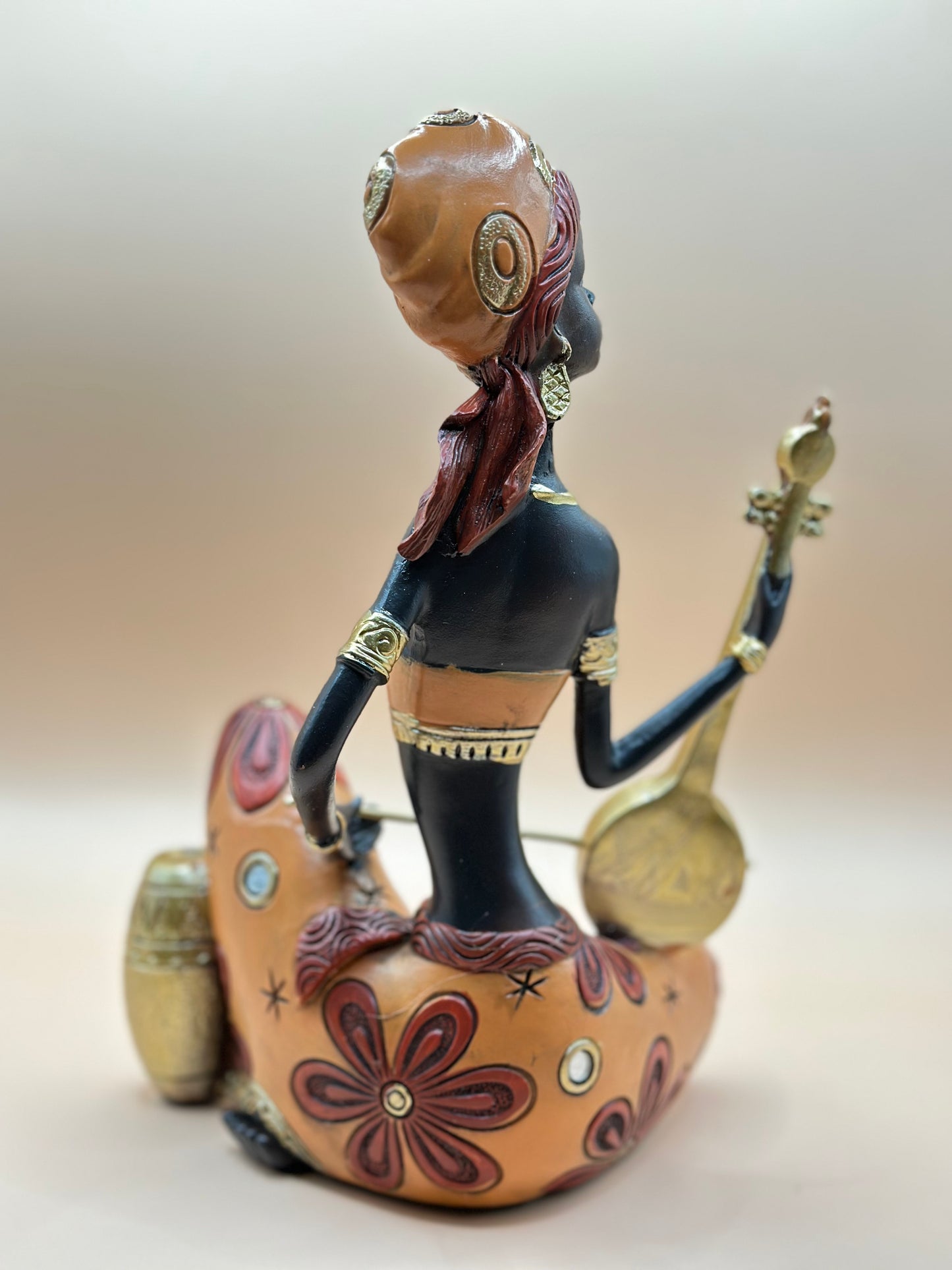 African Musician Figurine – 22 cm Handmade Resin Sculpture in Orange & Gold, Cultural Home Décor Art | Nestora Arts
