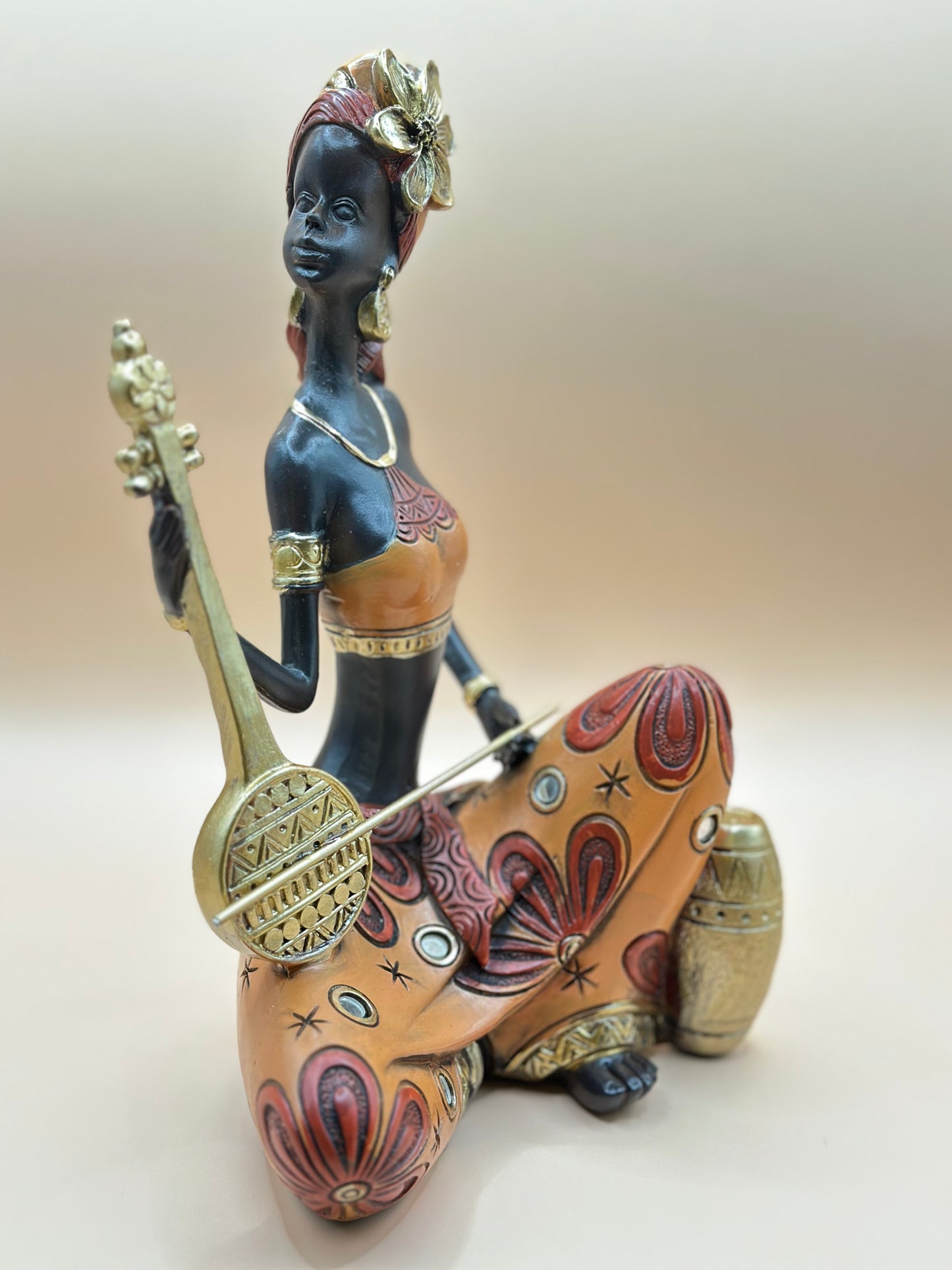 African Musician Figurine – 22 cm Handmade Resin Sculpture in Orange & Gold, Cultural Home Décor Art | Nestora Arts