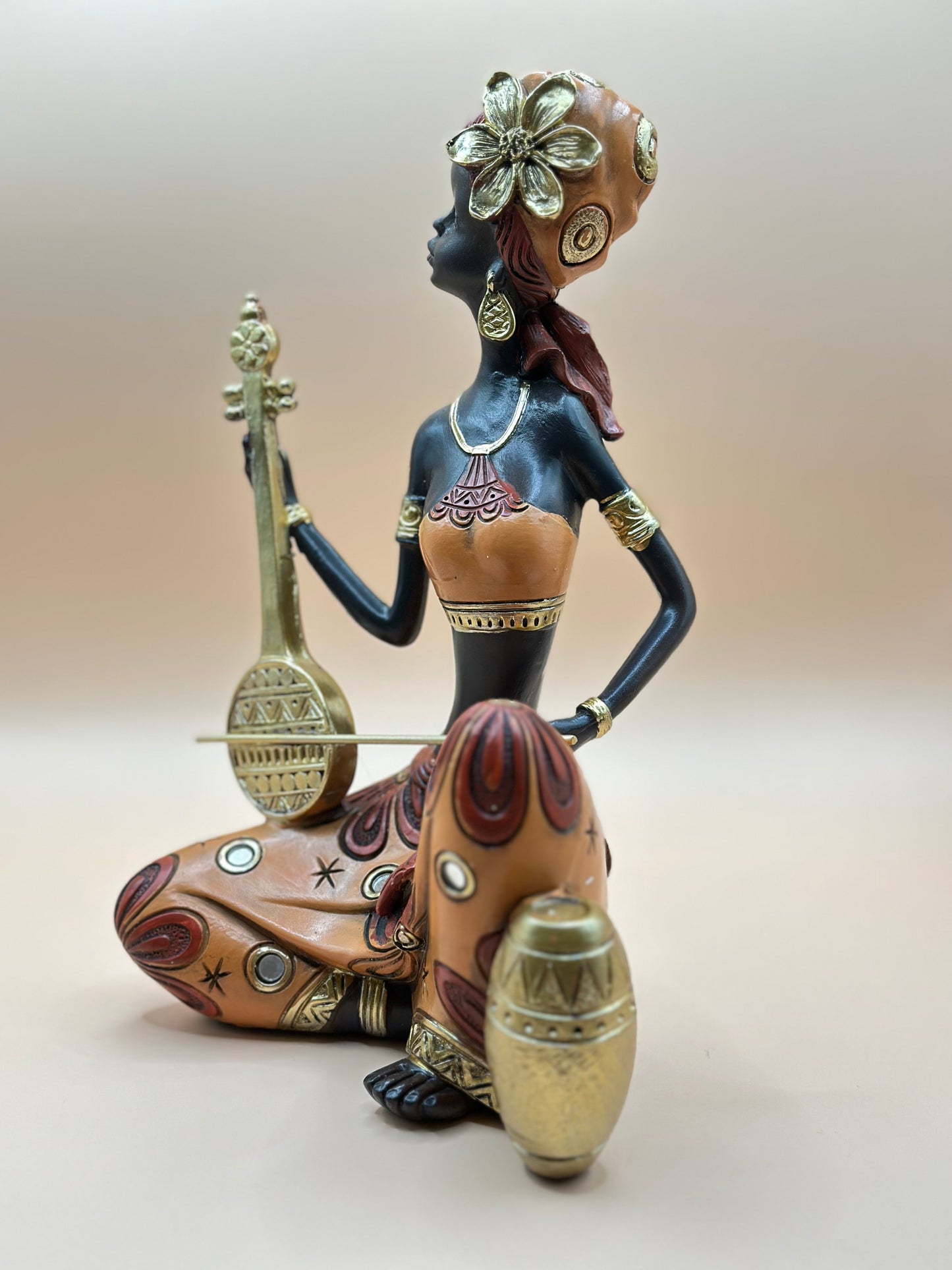 African Musician Figurine – 22 cm Handmade Resin Sculpture in Orange & Gold, Cultural Home Décor Art | Nestora Arts