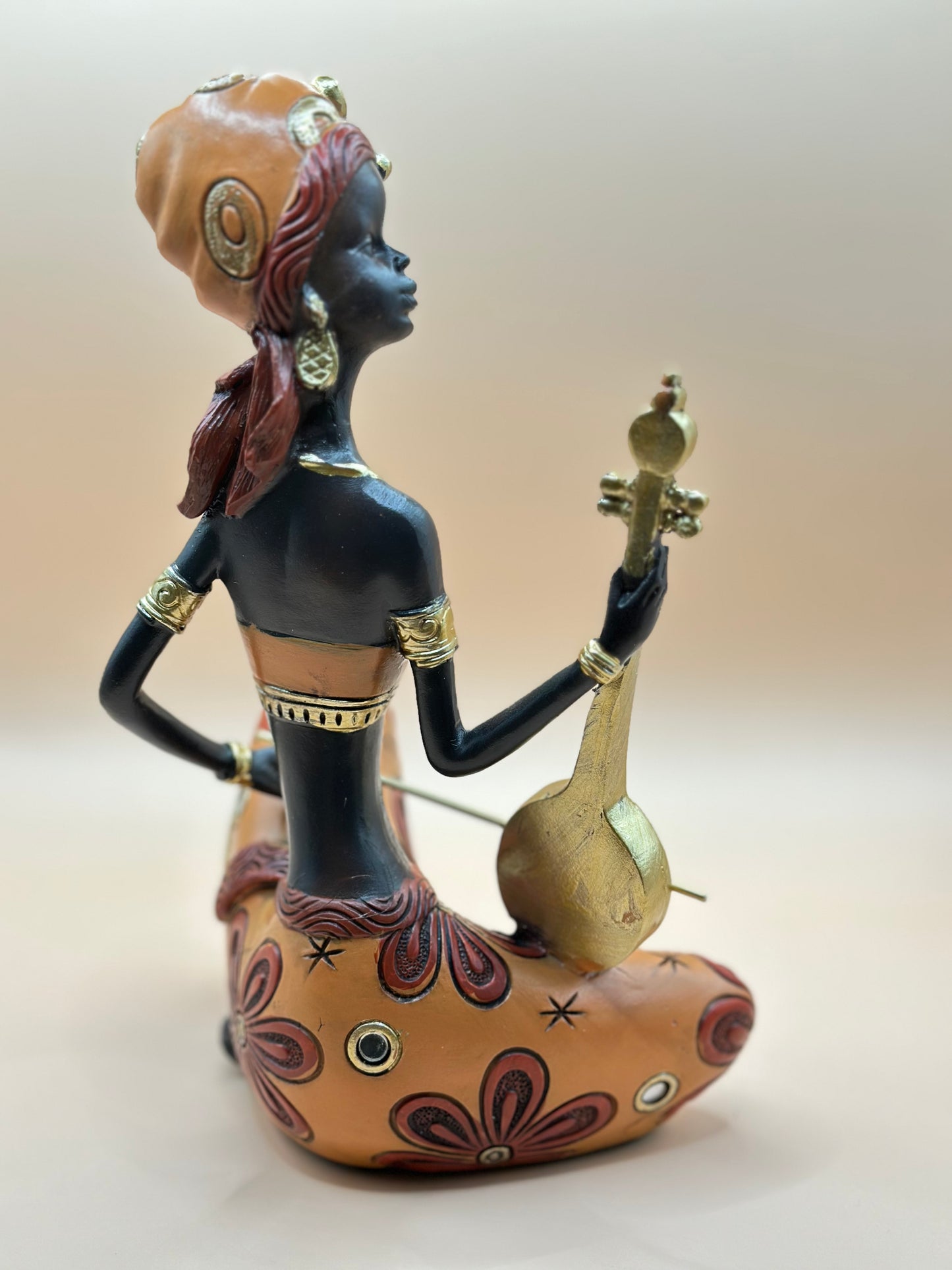 African Musician Figurine – 22 cm Handmade Resin Sculpture in Orange & Gold, Cultural Home Décor Art | Nestora Arts